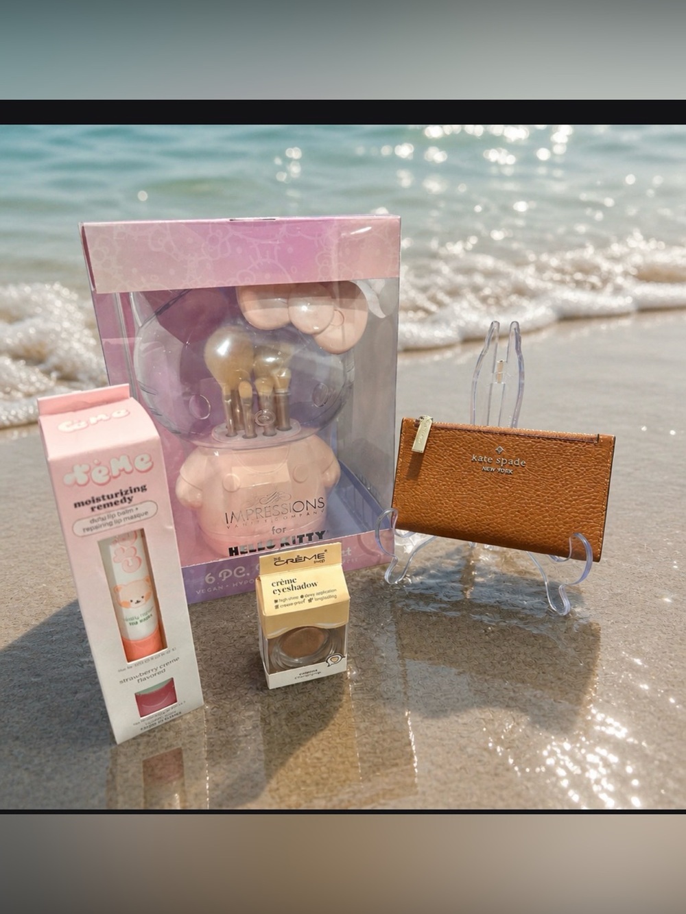 kate spade tan pebbled leather zip card case with a bundle of hello Kitty NWT
